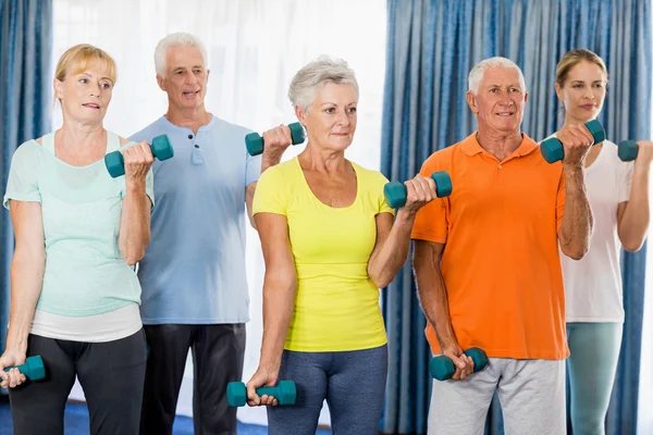 Seniors exercising with weights