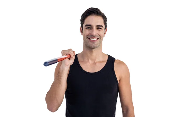 Portrait of happy male athlete holding javelin — Stock Photo, Image