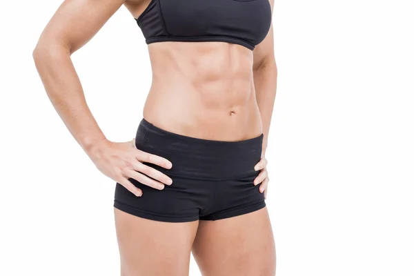 Female athlete posing with hands on hip — Stock Photo, Image