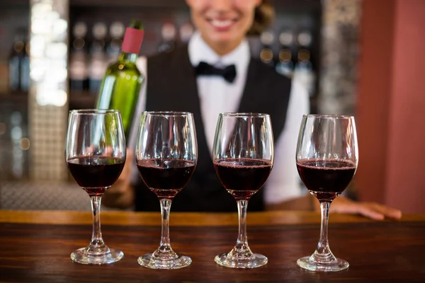 Four glasses of wine ready to serve — Stock Photo, Image