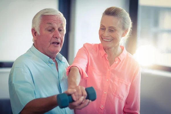 Senior couple exercising at home — Stock Photo, Image