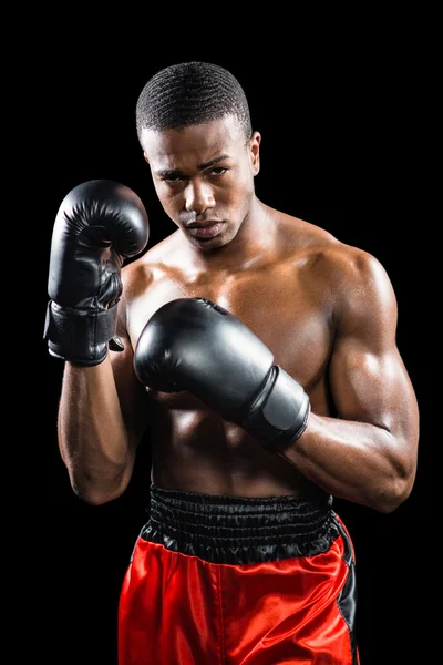 Portrait of boxer performing uppercut — Stock Photo, Image