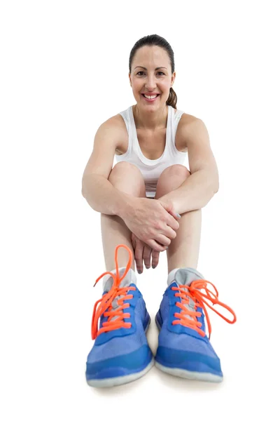 Portrait of athlete woman sitting with sports shoes — Stock Photo, Image