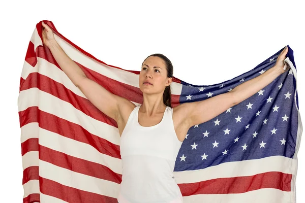 Female athlete posing with american flag — Stock Photo, Image