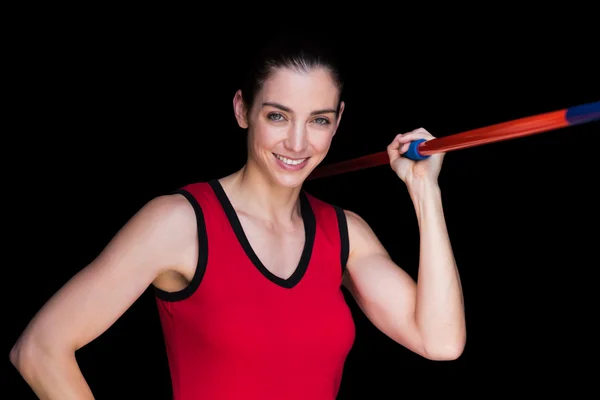 Atleta feminina jogando um dardo — Fotografia de Stock