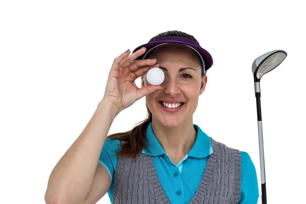 Bir golf kulübü ve golf topu ile poz golf oyuncu — Stok fotoğraf