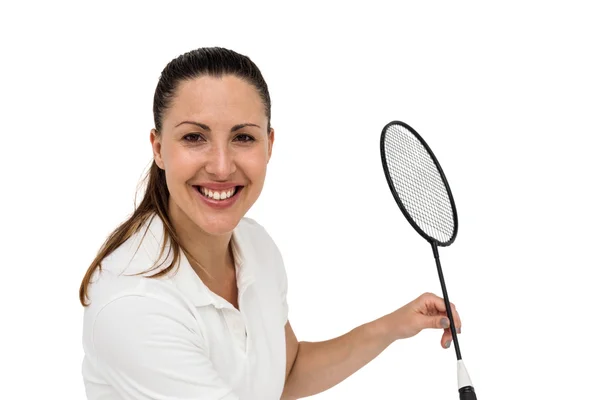 Kvinnelig spiller som spiller badminton – stockfoto