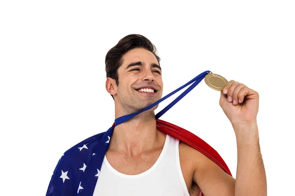 Athlete holding gold medal after victory — Stock Photo, Image