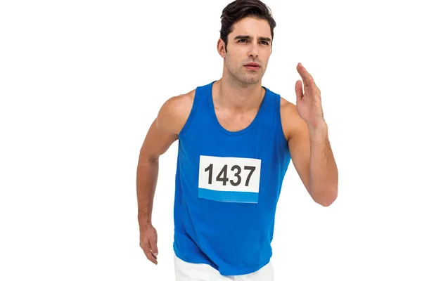 Male athlete running on white background — Stock Photo, Image