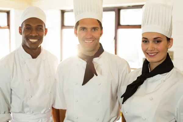 Three chefs in commercial kitchen — Stock Photo, Image