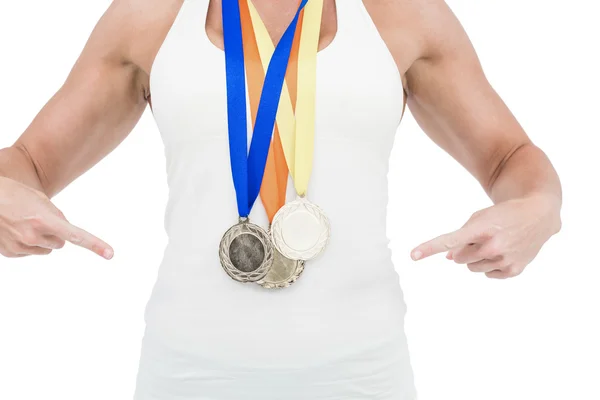 Αθλήτρια επισημαίνοντας τα μετάλλια — Φωτογραφία Αρχείου