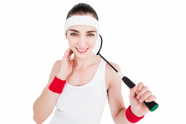 Atleta feminina jogando badminton — Fotografia de Stock