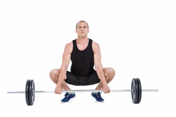 Fisiculturista levantando pesados pesos barbell — Fotografia de Stock