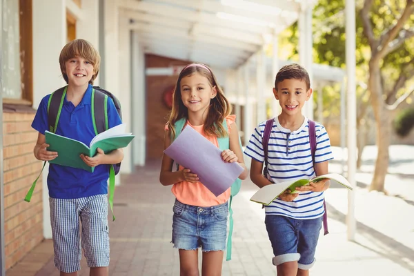 School kids in school corridor — Stock Photo, Image