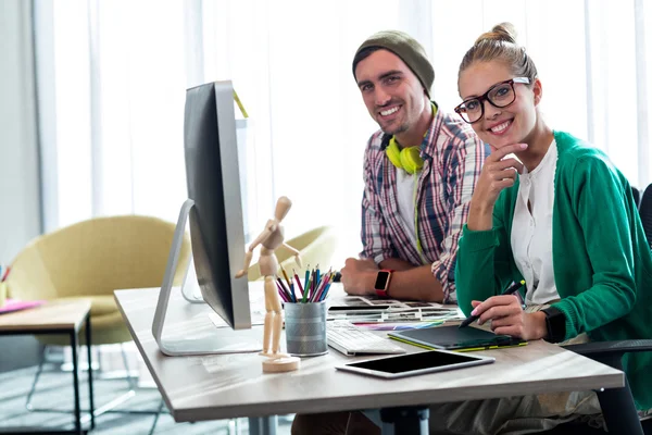 Casual colleagues smiling at camera — Stock Photo, Image