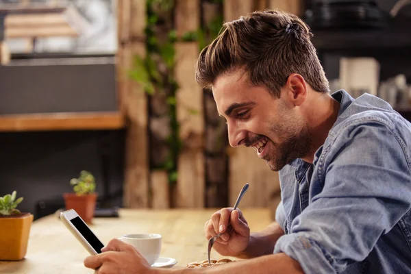 Hipster man using phone at cafe — Stock Photo, Image