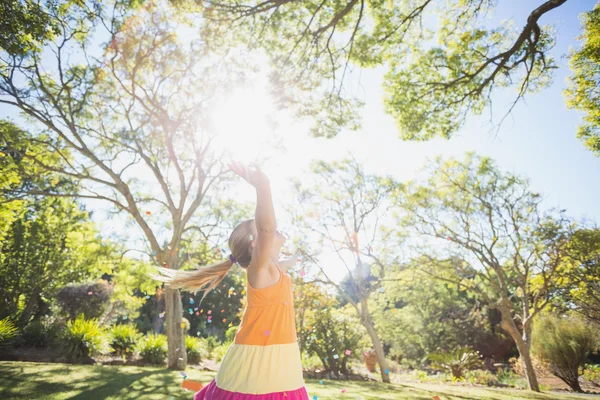 Girl standing with arms outstretched — Stock Photo, Image