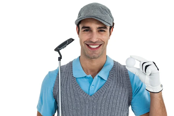 Golf player showing golf ball and holding golf club — Stock Photo, Image