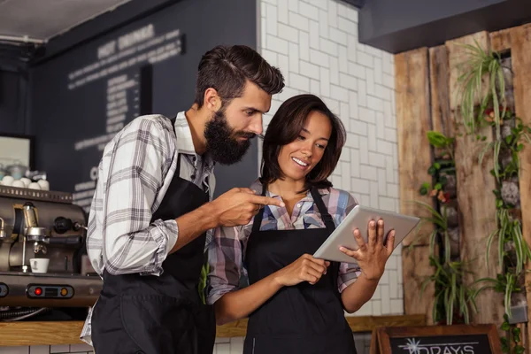 Waiters using tablet computer — Stock Photo, Image