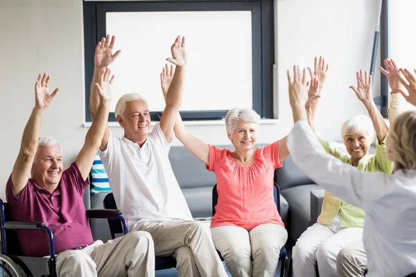 Seniors doing some exercises — Stock Photo, Image