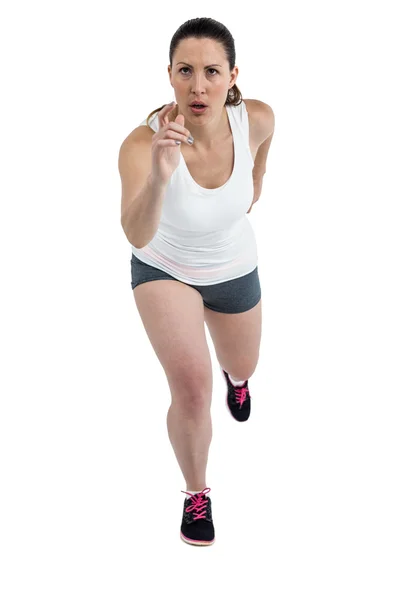 Energetic female athlete running — Stock Photo, Image