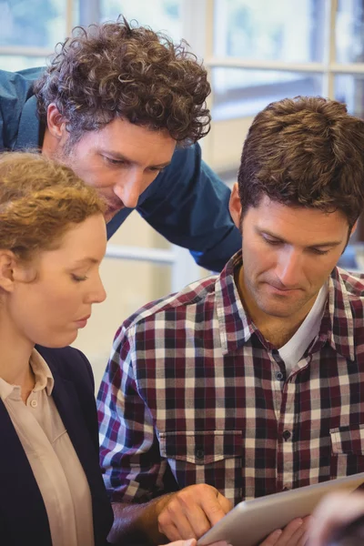 Casual colleagues using a tablet — Stock Photo, Image