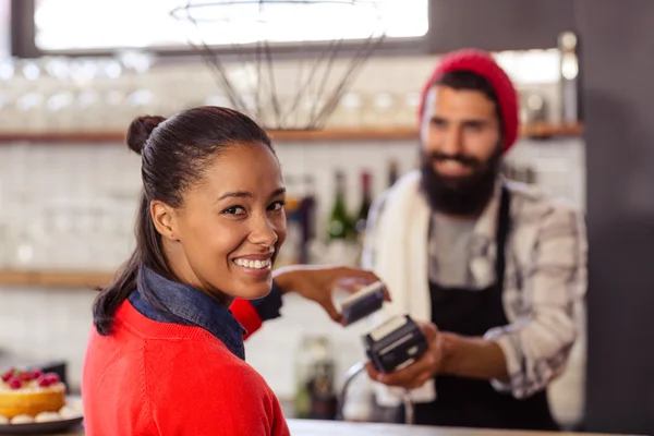 Seller taking payment with bank card reader — Stock Photo, Image