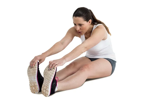 Atleta mulher fazendo exercício de alongamento — Fotografia de Stock