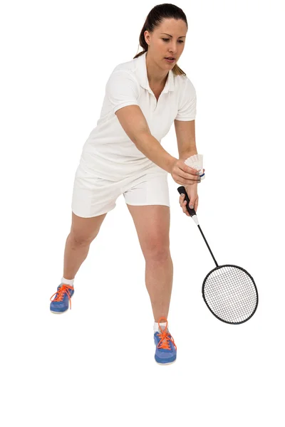 Female athlete holding a badminton racquet ready to serve — Stock Photo, Image