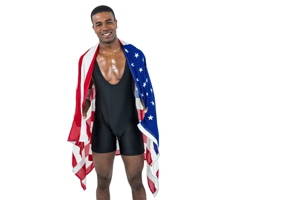 Atleta com bandeira americana enrolada em torno de seu corpo — Fotografia de Stock