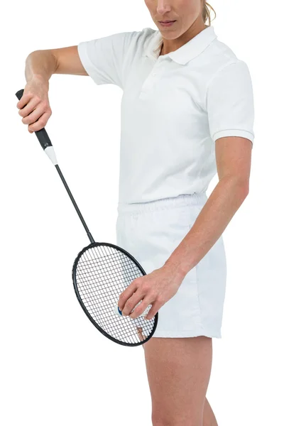 Female athlete holding a badminton racquet ready to serve — Stock Photo, Image