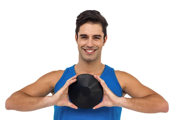 Male athlete posing with discus throw — Stock Photo, Image
