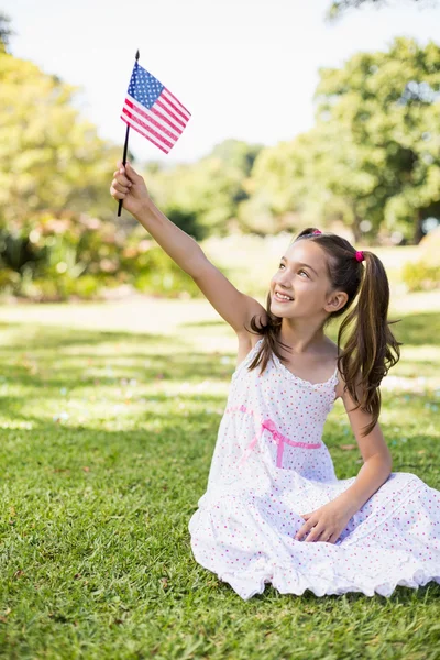 Menina segurando uma bandeira americana Imagens Royalty-Free