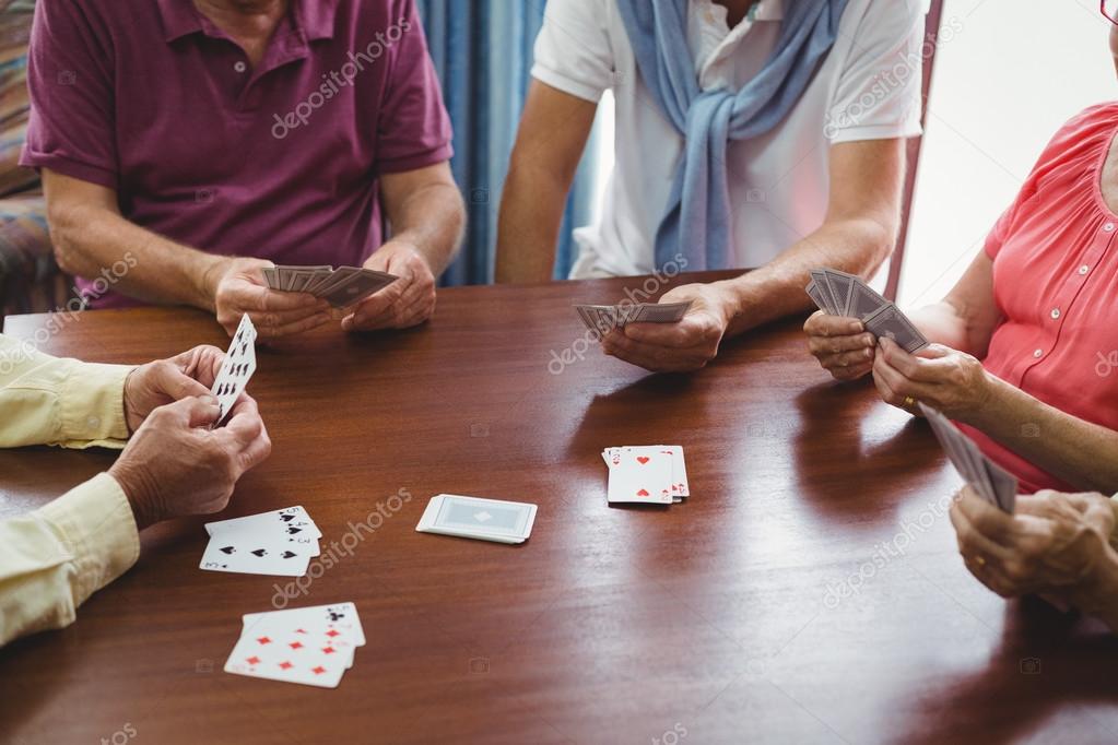 Seniors playing cards — Stock Photo © Wavebreakmedia 112934726