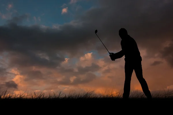 Golf player taking shot — Stock Photo, Image