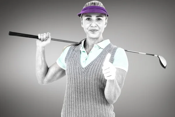 Blonde gry w golfa i pokazuje kciuk w górę — Zdjęcie stockowe