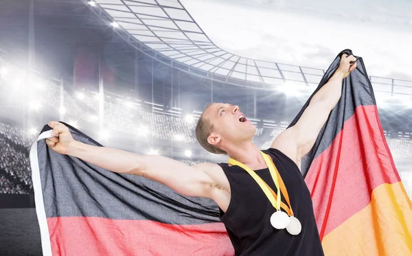 Atleta posando com medalhas de ouro olímpicas — Fotografia de Stock