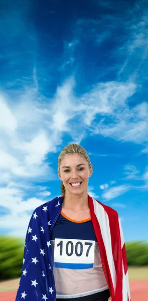 Athlete with american flag wrapped — Stock Photo, Image