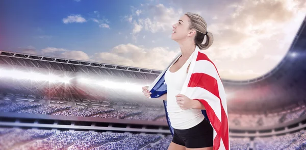 Atleta com bandeira americana nos ombros — Fotografia de Stock