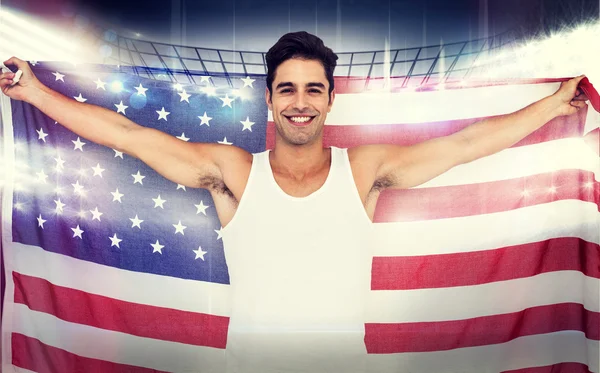Atleta posando com bandeira americana — Fotografia de Stock