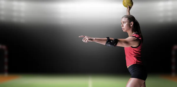 Athlete with elbow pads throwing handball — Stock Photo, Image