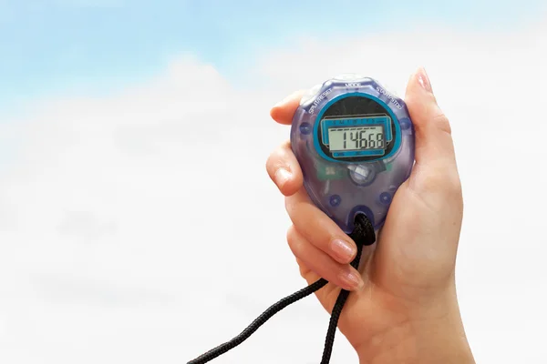 Hand holding timer on white — Stock Photo, Image