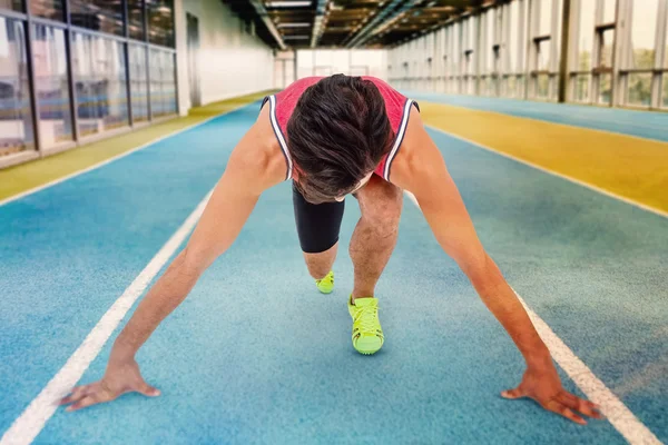 Atleta em posição pronta para correr — Fotografia de Stock