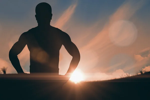 Athlete standing with hands on hips — Stock Photo, Image