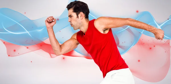 Männlicher Athlet läuft auf weißem Hintergrund — Stockfoto