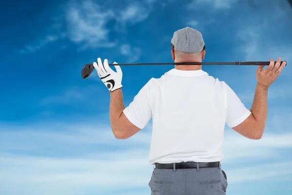 Golfspiller holder golfklub - Stock-foto