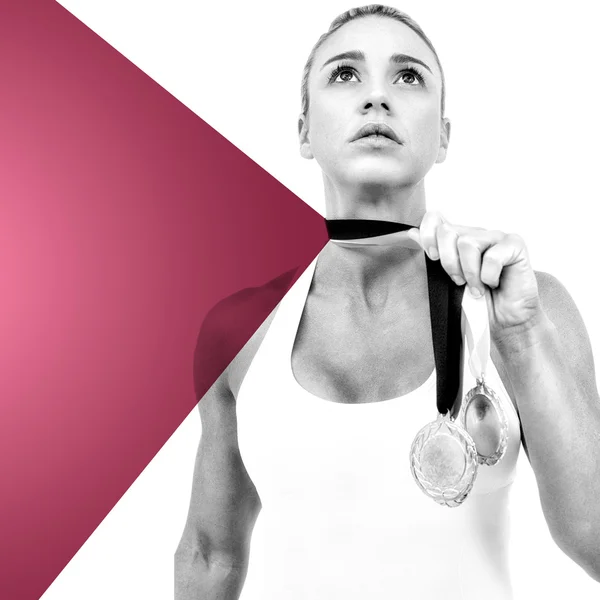 Kvindelig atlet holder medaljer - Stock-foto