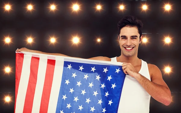 Athlet posiert mit amerikanischer Flagge — Stockfoto