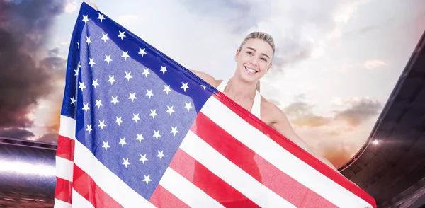 Atleta segurando bandeira americana — Fotografia de Stock