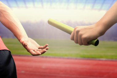 athlete passing baton to partner clipart